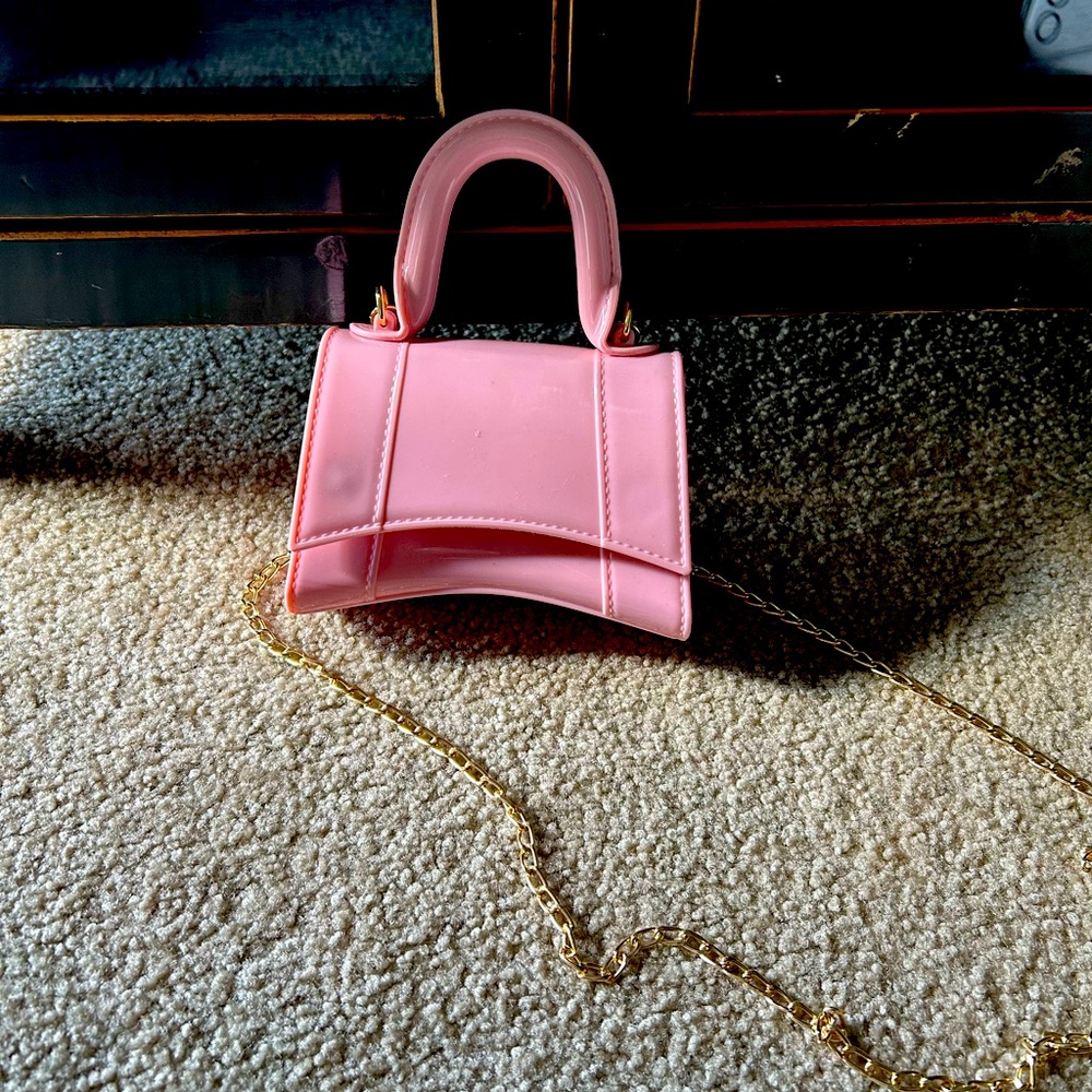 Never used - Mini, rubberized sling bag